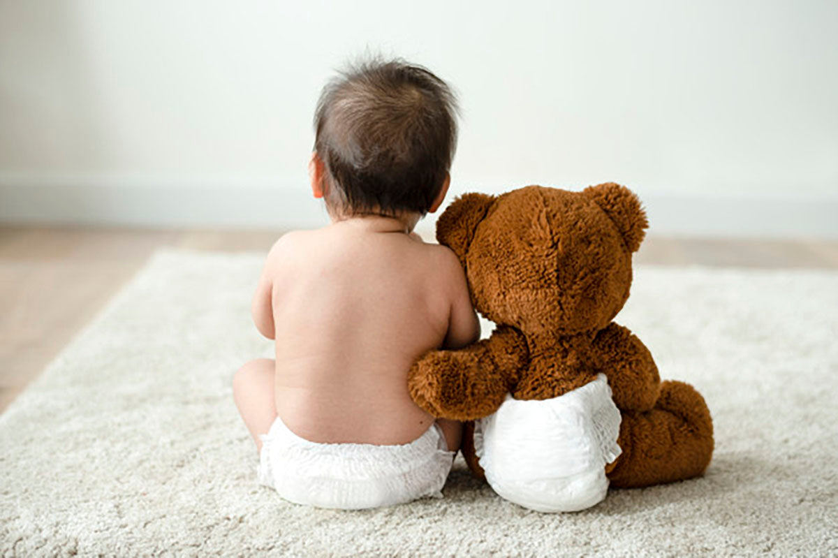 baby with teddy bear