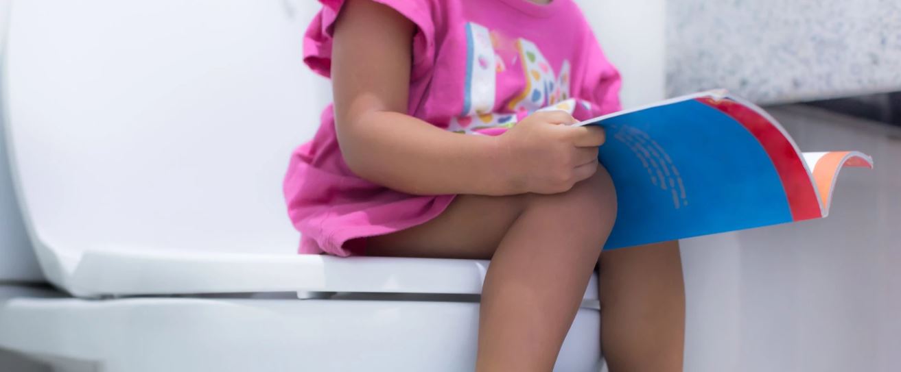 toddler potty training girl on toilet 