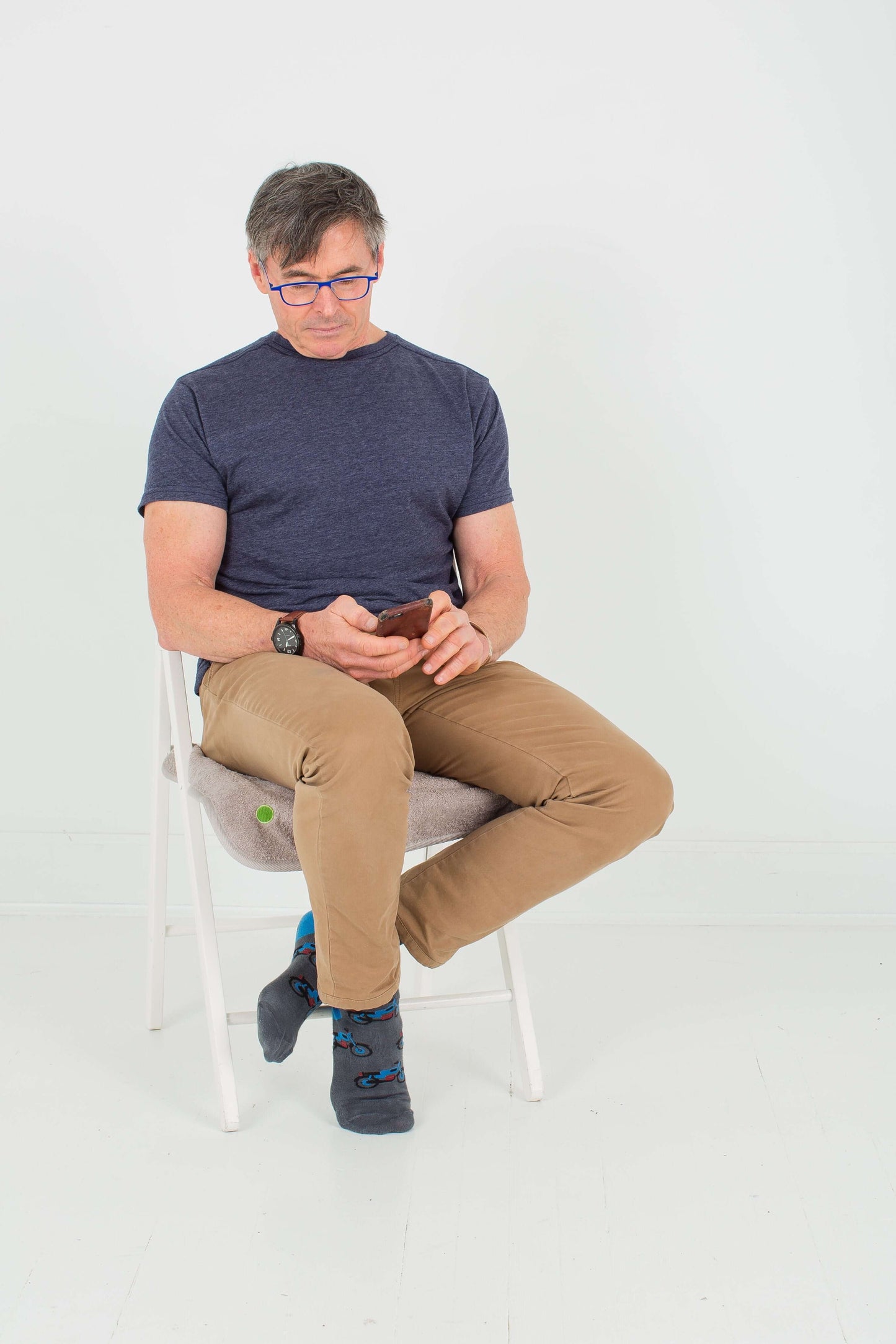 Man using small PeapodMat as a chair protector