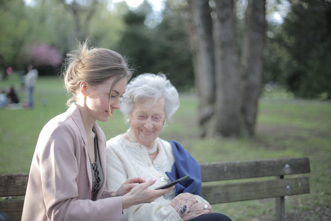 girl caring for elderly lady