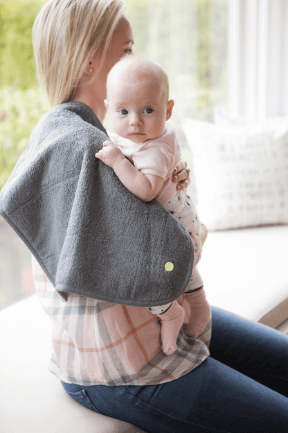Mother using PeapodMat to protect clothing while nursing